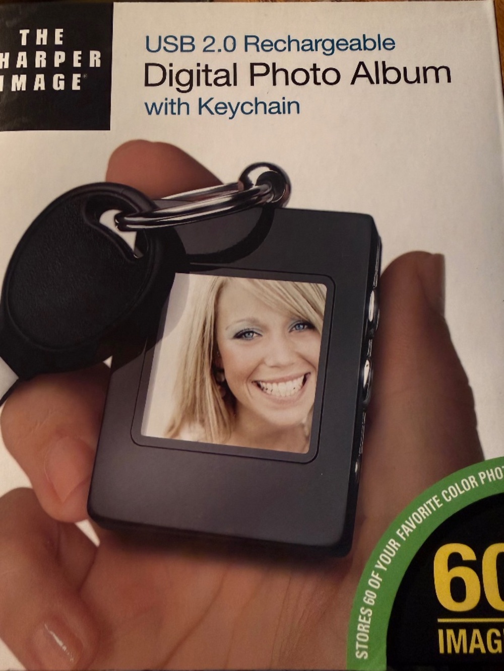 NEW.SHARPER IMAGE..DIGITAL PHOTO ALBUM-RECHARGABLE-60 IMAGES